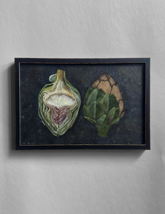 Framed artwork of two artichokes on a dark background. By Adi Radai