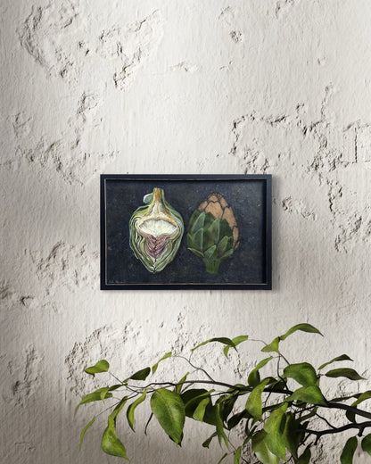 Framed artwork of two artichokes on a textured dark background. By Adi Radai